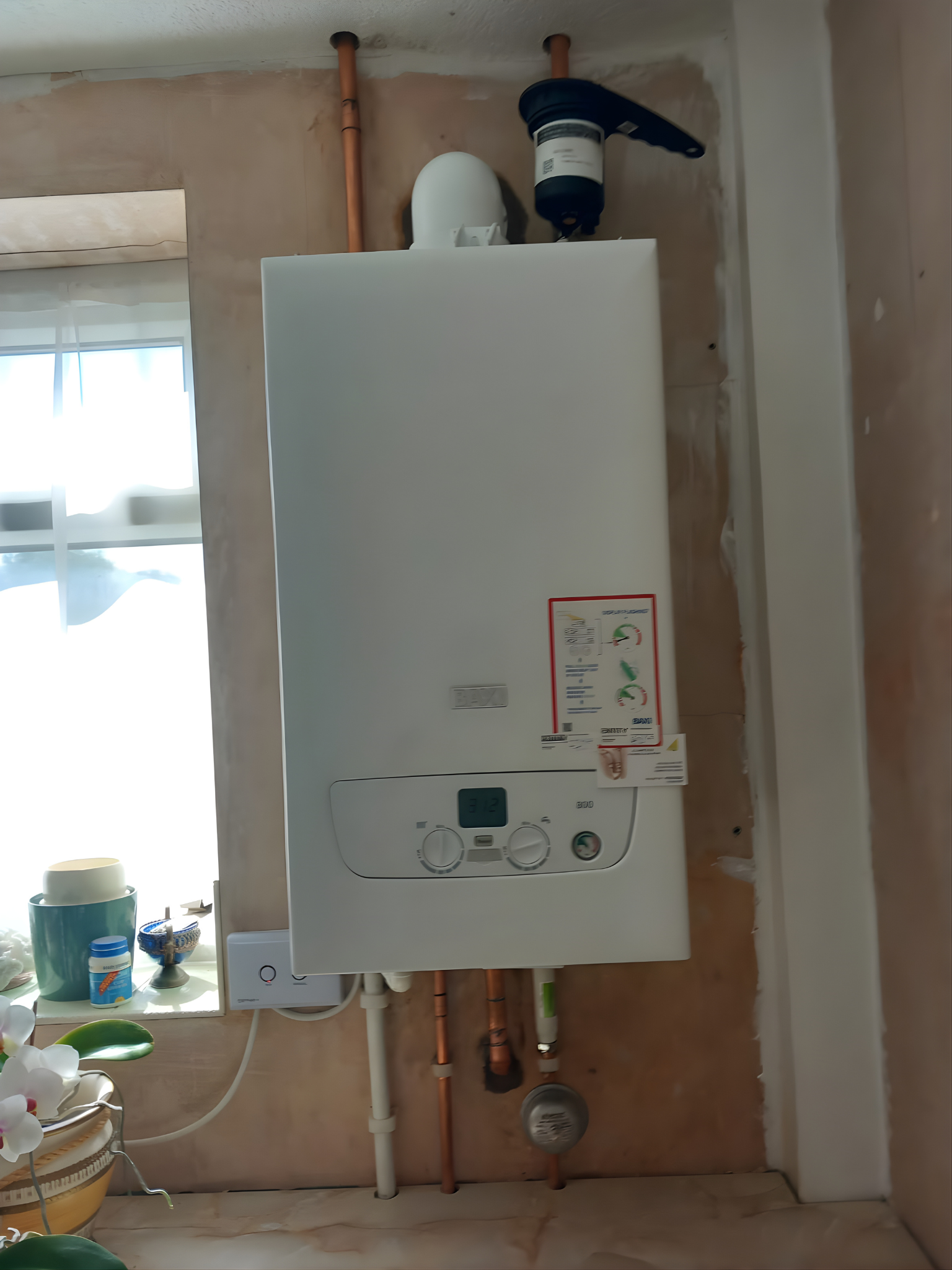 Boiler and cylinder installation in a cupboard